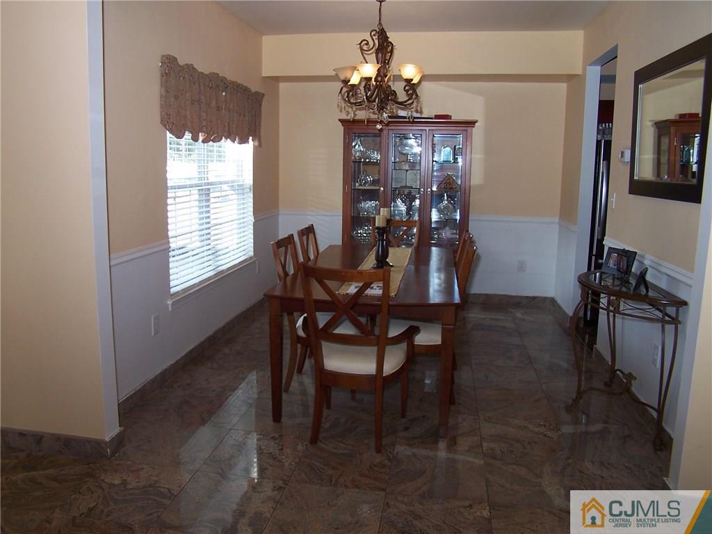 6 Nutmeg Road Aberdeen, NJ 07747 - Photo 8 of 24 a dining room with furniture and window