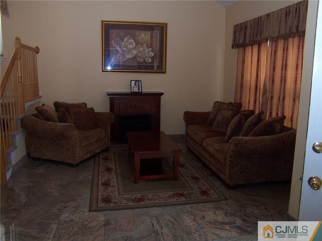 6 Nutmeg Road Aberdeen, NJ 07747 - Photo 10 of 24 a living room with furniture and a window