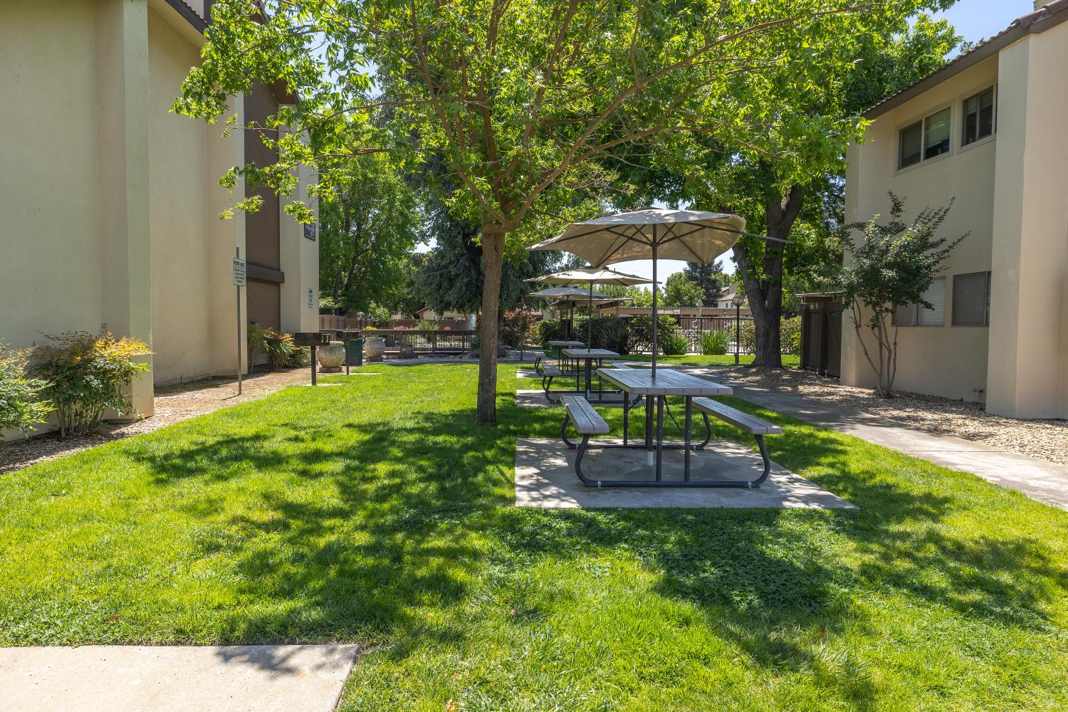 3700 Tully Road, Unit 5 Modesto, CA 95356 - Photo 34 of 38 a view of a backyard with sitting area and slide