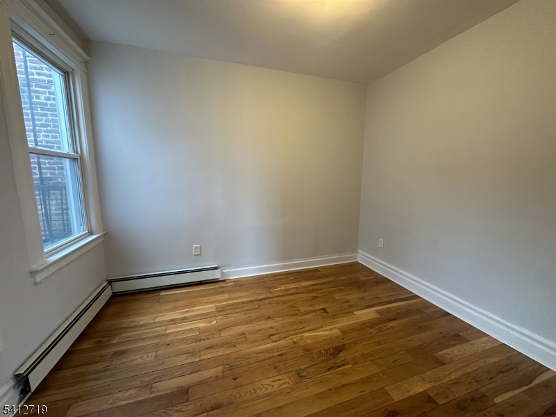 159 21st Street, Unit 2 Irvington, NJ 07111 - Photo 3 of 9 a view of an empty room and window