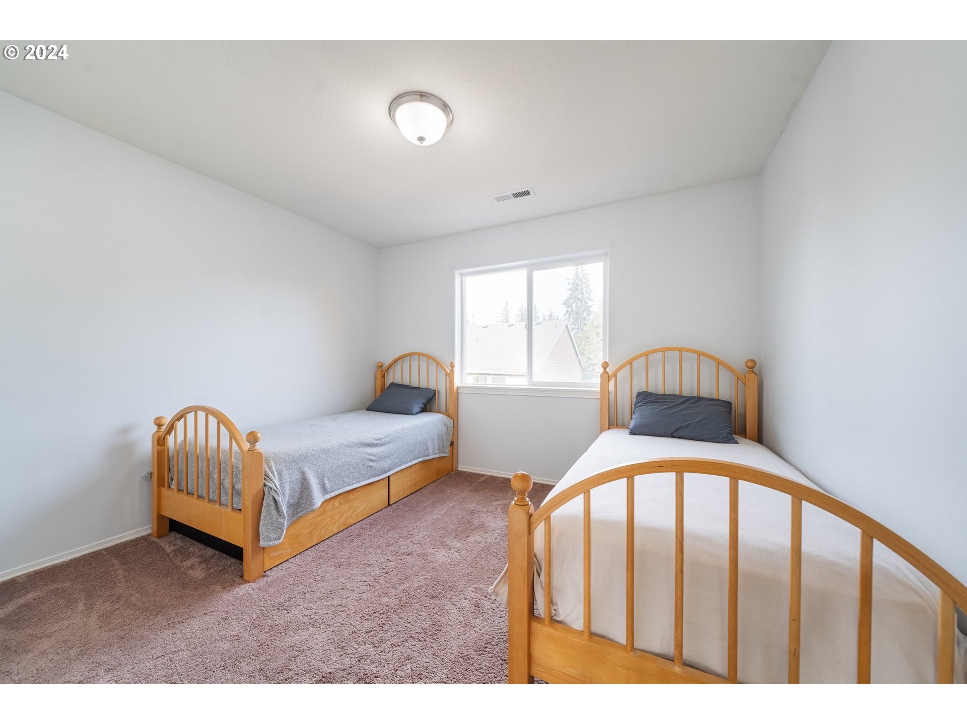 39833 Evans Street Sandy, OR 97055 - Photo 19 of 37 a bedroom with a bed and window