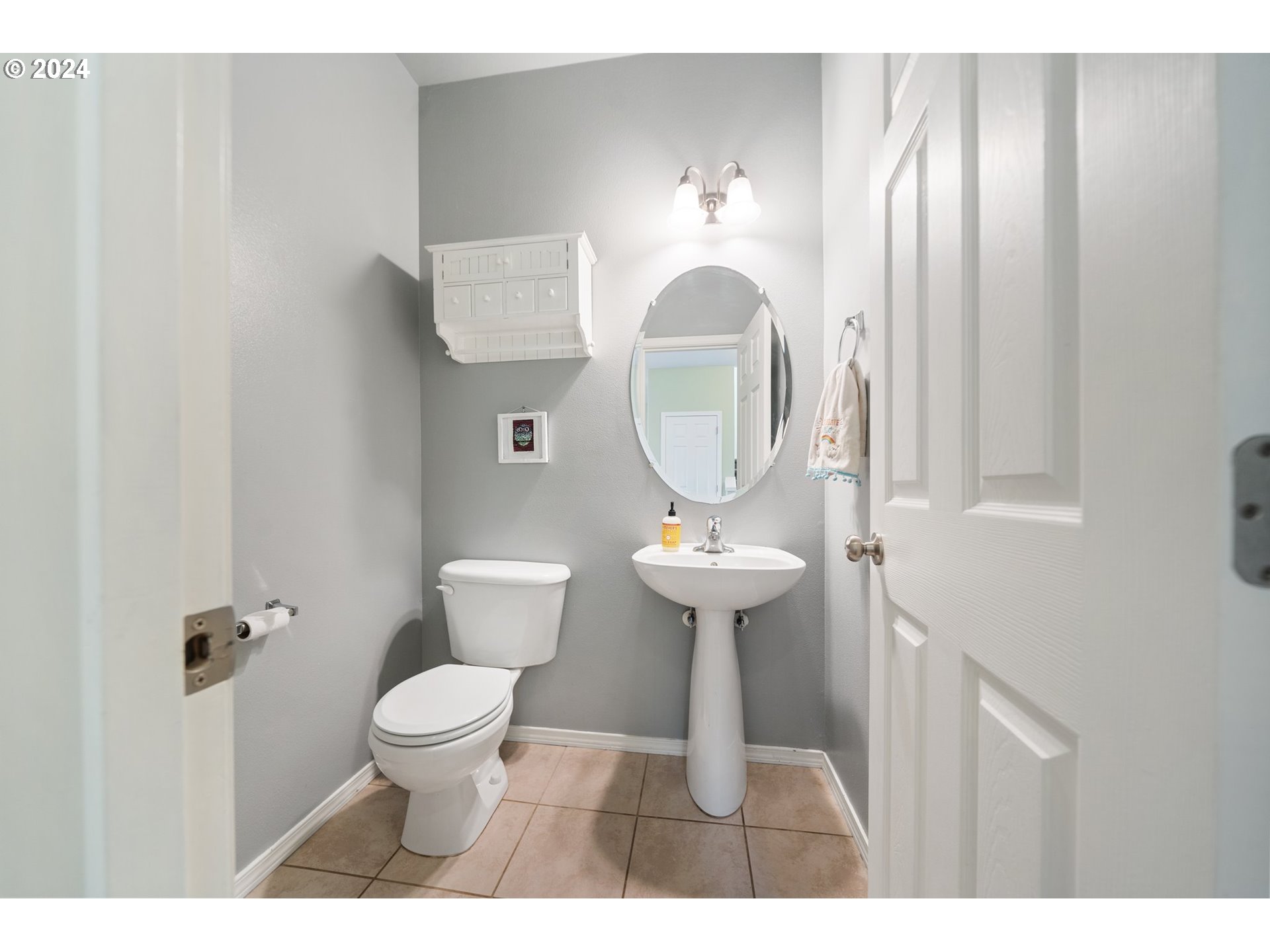 39833 Evans Street Sandy, OR 97055 - Photo 24 of 37 a bathroom with a toilet sink and mirror