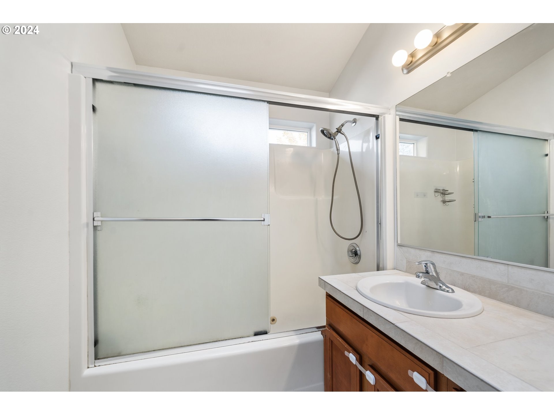39833 Evans Street Sandy, OR 97055 - Photo 26 of 37 a bathroom with a granite countertop shower sink and mirror