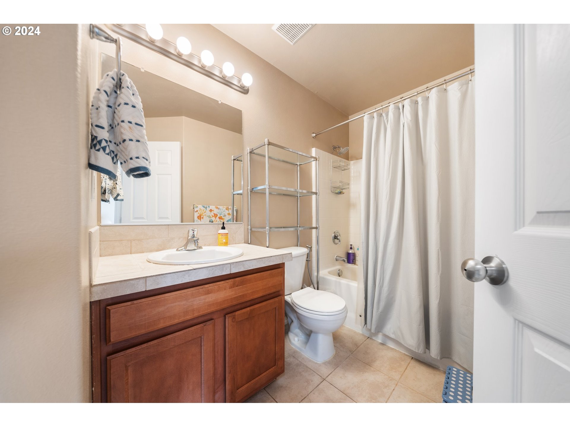 39833 Evans Street Sandy, OR 97055 - Photo 27 of 37 a bathroom with a sink a toilet and a mirror