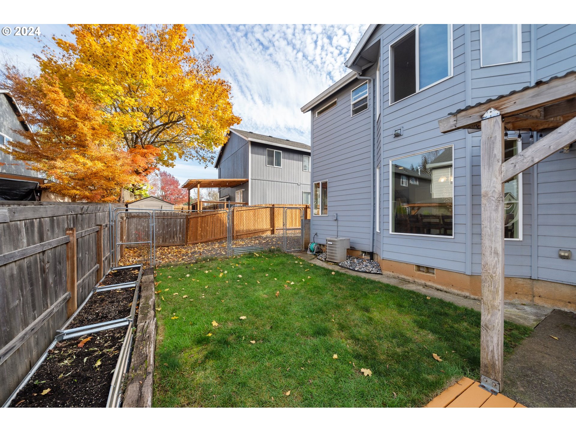 39833 Evans Street Sandy, OR 97055 - Photo 35 of 37 a view of a backyard with wooden fence and a bench