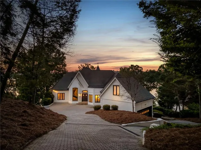 a aerial view of a house with swimming pool and sitting area