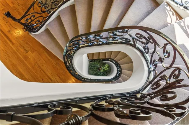 a en suite bathroom with a granite countertop sink and a mirror