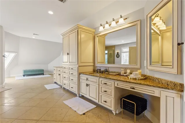 an aerial view of a house with a yard and green space