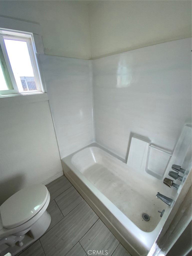 13193 Navajo Road, Unit 3 Apple Valley, CA 92308 - Photo 16 of 17 a bathroom with a toilet and a sink