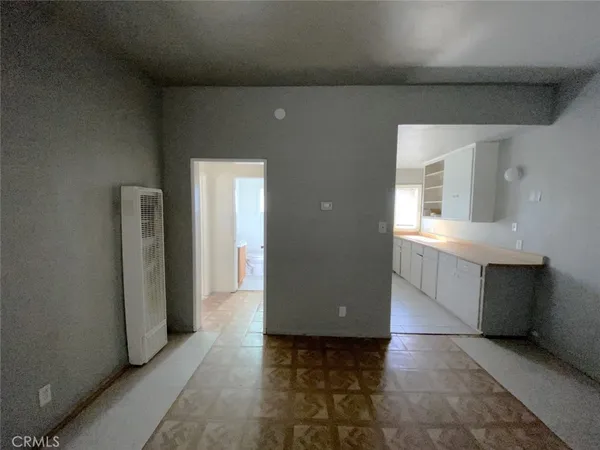 a view of a hallway with entryway door