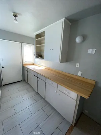a view of cabinets and window