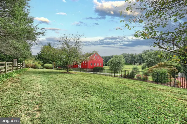 a bedroom with furniture and a fireplace