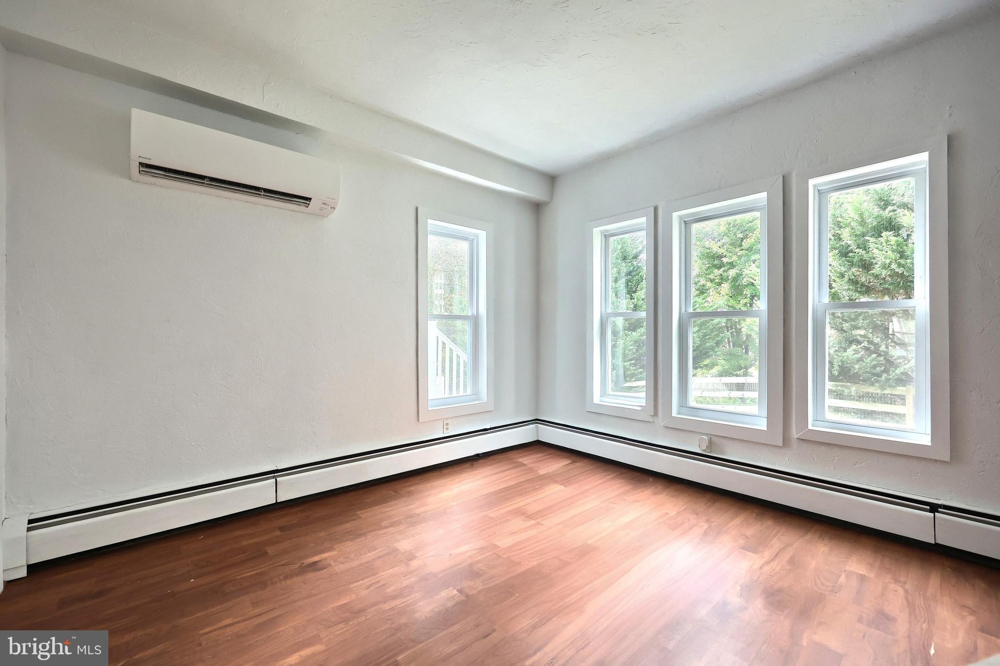108 Kimberly Drive Hanover, PA 17331 - Photo 62 of 95 an empty room with wooden floor and windows