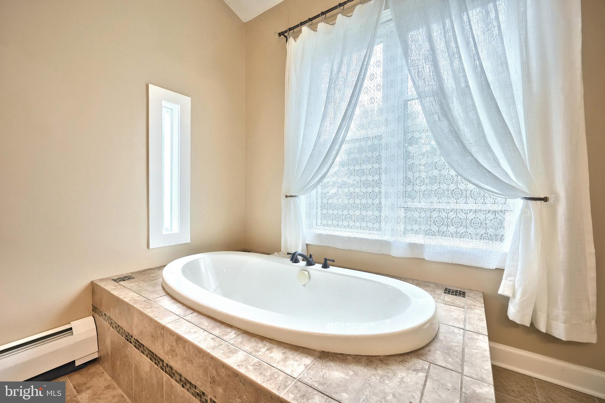 108 Kimberly Drive Hanover, PA 17331 - Photo 81 of 95 a bath tub sitting in a bathroom next to a window