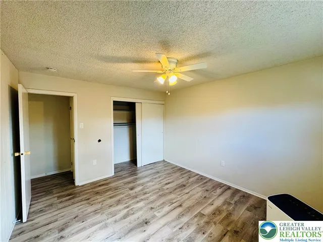 a view of an empty room and wooden floor