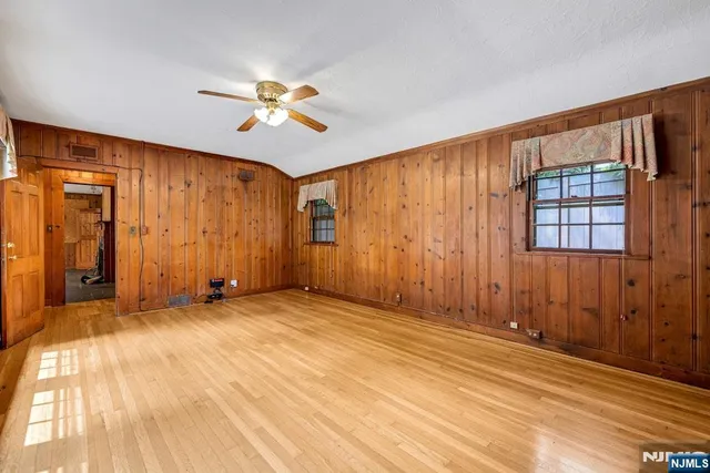 a view of an empty room with glass door