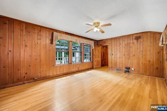 a room with a closet and wooden floor
