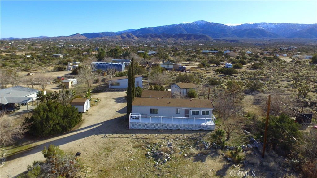 569 Smoke Tree Road Pinon Hills, CA 92372 - Photo 1 of 1 a view of a city with mountain