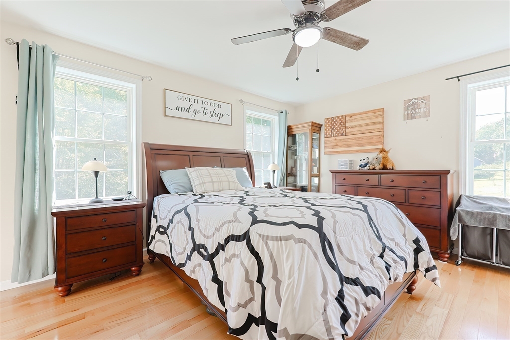 30 Town Farm Road North Brookfield, MA 01535 - Photo 18 of 42 a bedroom with a bed and a chandelier