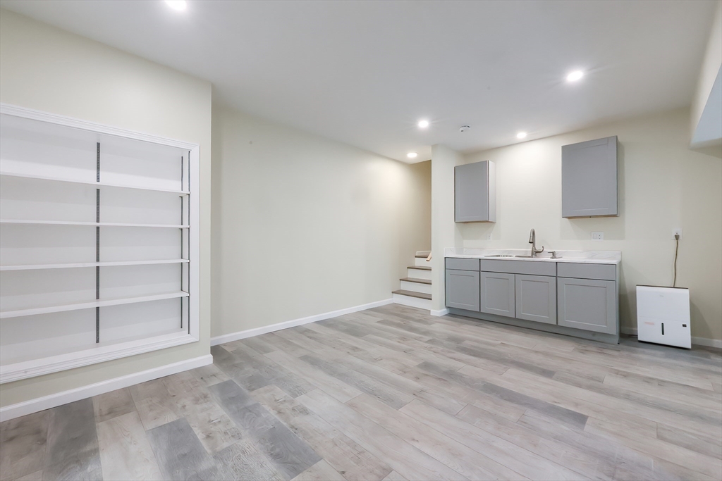 30 Town Farm Road North Brookfield, MA 01535 - Photo 31 of 42 a view of a kitchen with a sink and dishwasher with white cabinets