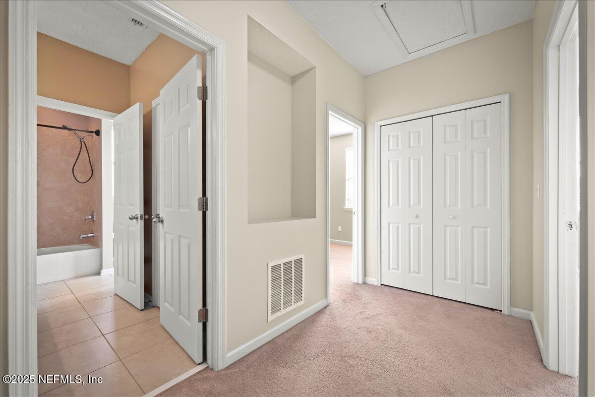 168 Plaza Del Rio Drive St. Augustine, FL 32084 - Photo 22 of 34 a view of a hallway to rooms