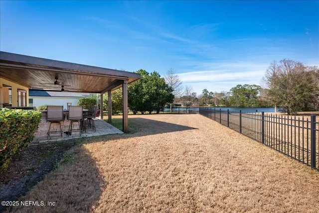 a view of a backyard with sitting area