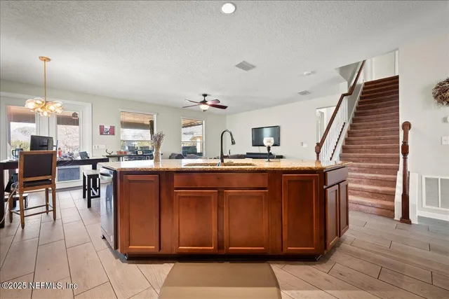 a kitchen with kitchen island cabinets and window