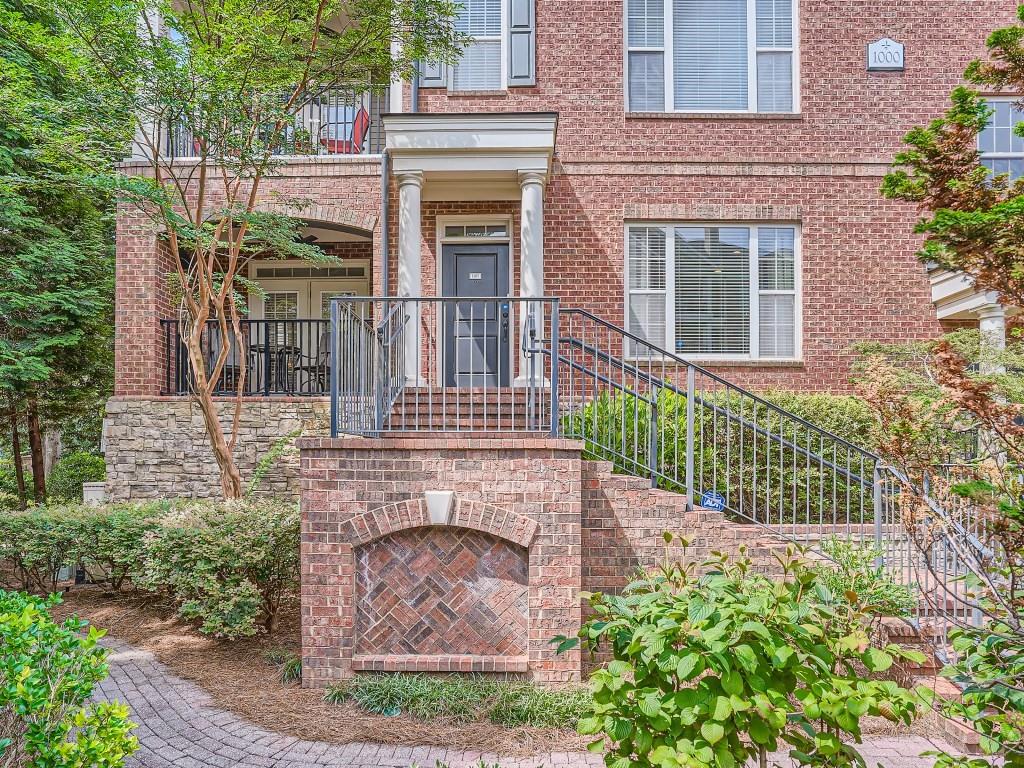 2300 Peachford Road, Unit 1107 Atlanta, GA 30338 - Photo 1 of 1 a front view of a house with a garden