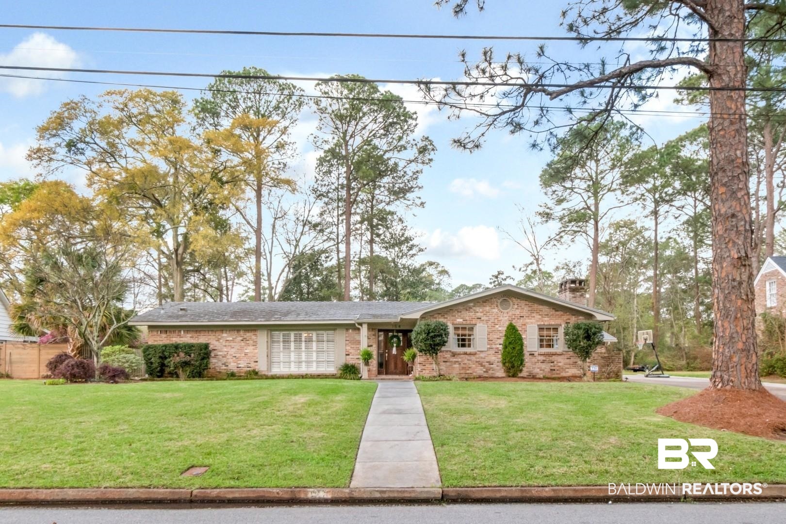 154 Fenwick Road Mobile, AL 36608 - Photo 1 of 48 Ranch-style home with a front lawn, brick siding, and a chimney