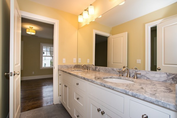 14 Winslow Road Wellesley, MA 02481 - Photo 13 of 18 a bathroom with a sink double vanity and a mirror