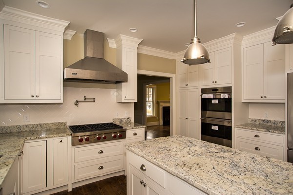 14 Winslow Road Wellesley, MA 02481 - Photo 3 of 18 a kitchen with stainless steel appliances granite countertop a stove and refrigerator