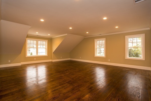 14 Winslow Road Wellesley, MA 02481 - Photo 8 of 18 a view of an empty room with wooden floor and window