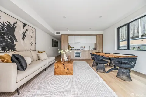 a living room with furniture and a table