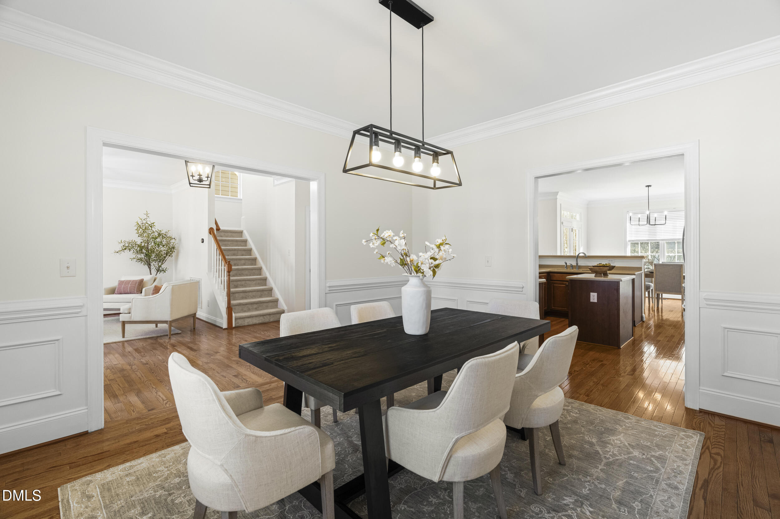 105 Bayless Ridge Court Morrisville, NC 27560 - Photo 11 of 42 a view of a dining room with furniture and wooden floor