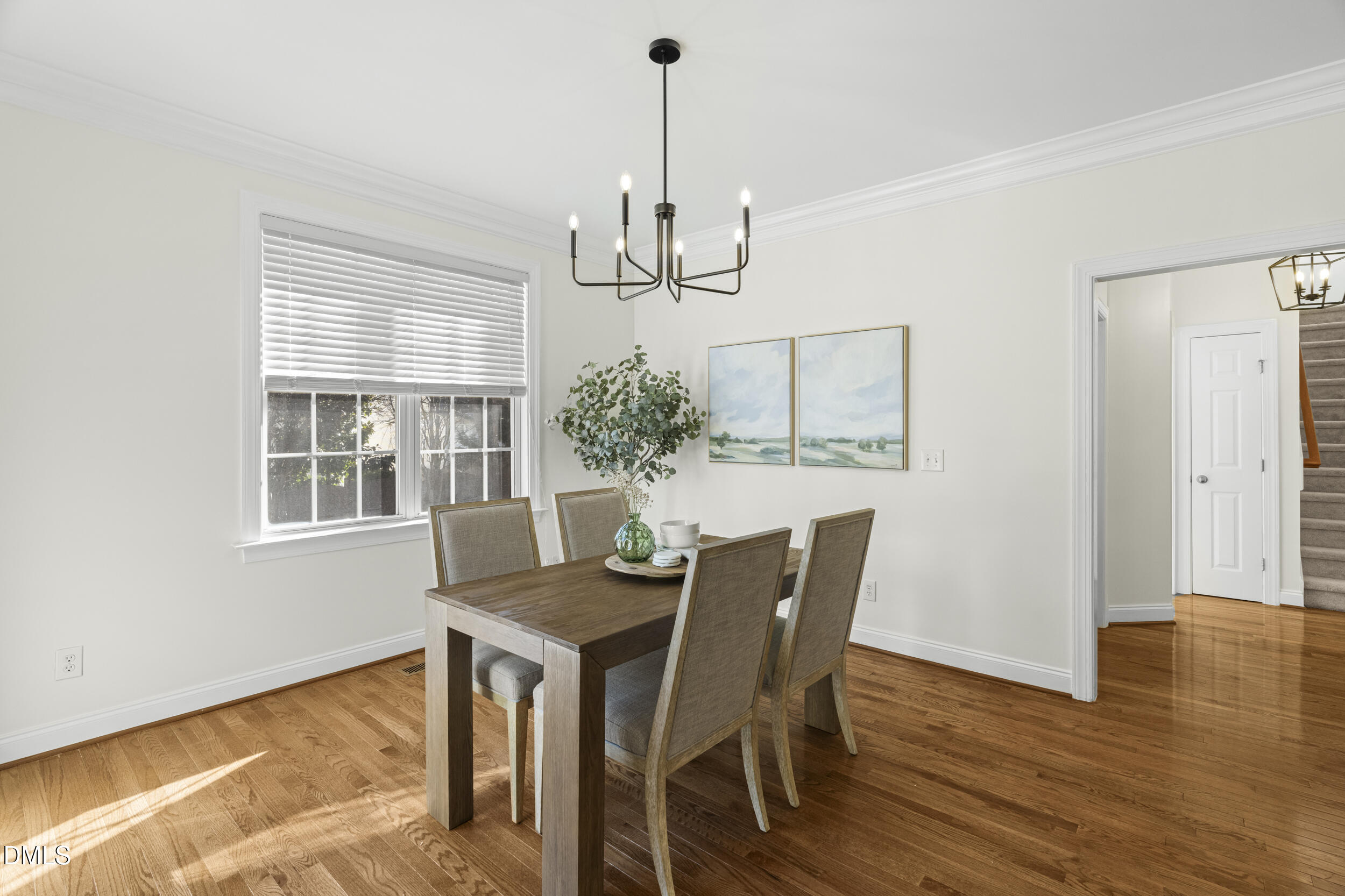 105 Bayless Ridge Court Morrisville, NC 27560 - Photo 17 of 43 a view of a dining room with furniture window and wooden floor