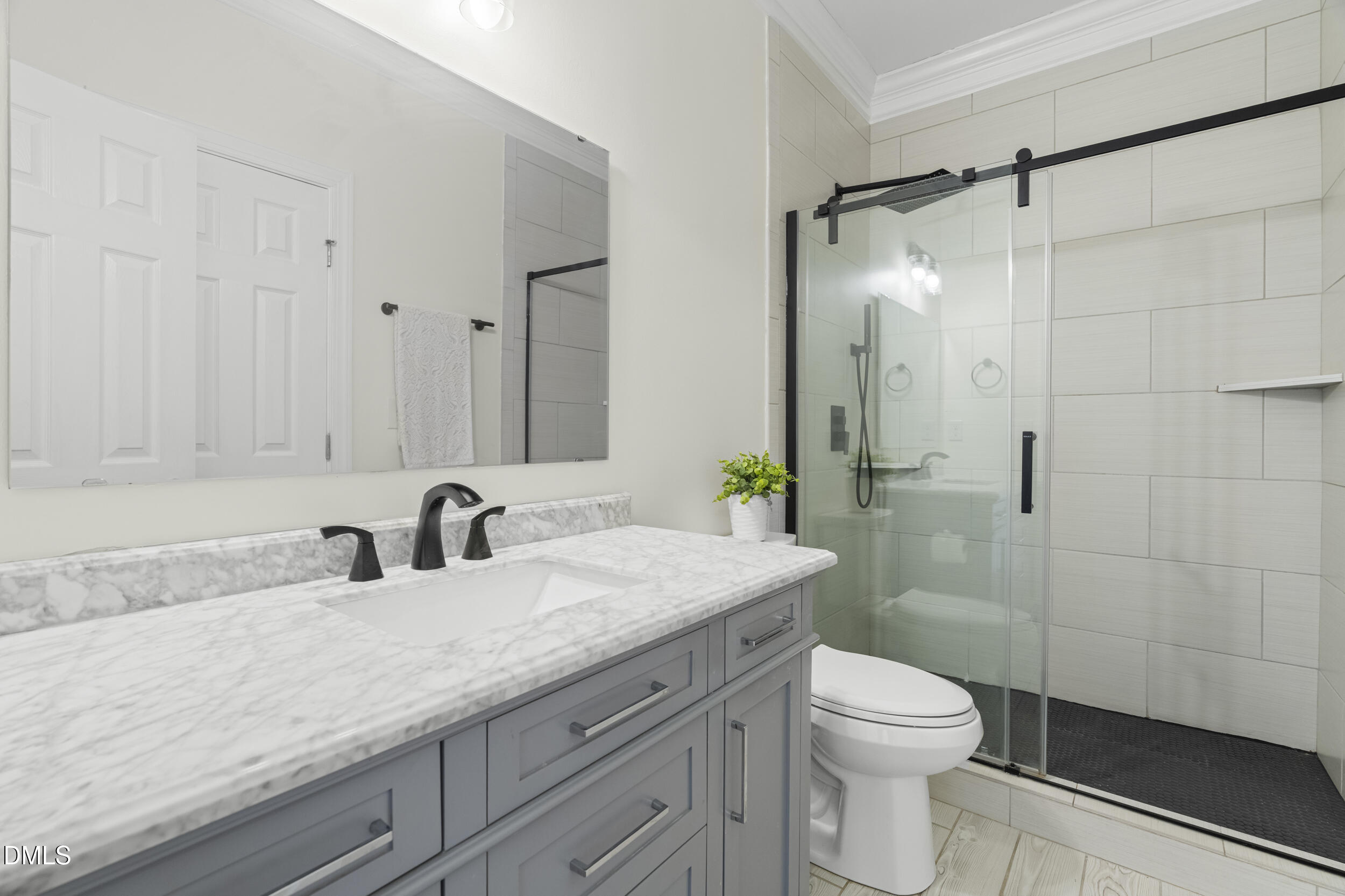 105 Bayless Ridge Court Morrisville, NC 27560 - Photo 20 of 42 a bathroom with a granite countertop sink a toilet and shower