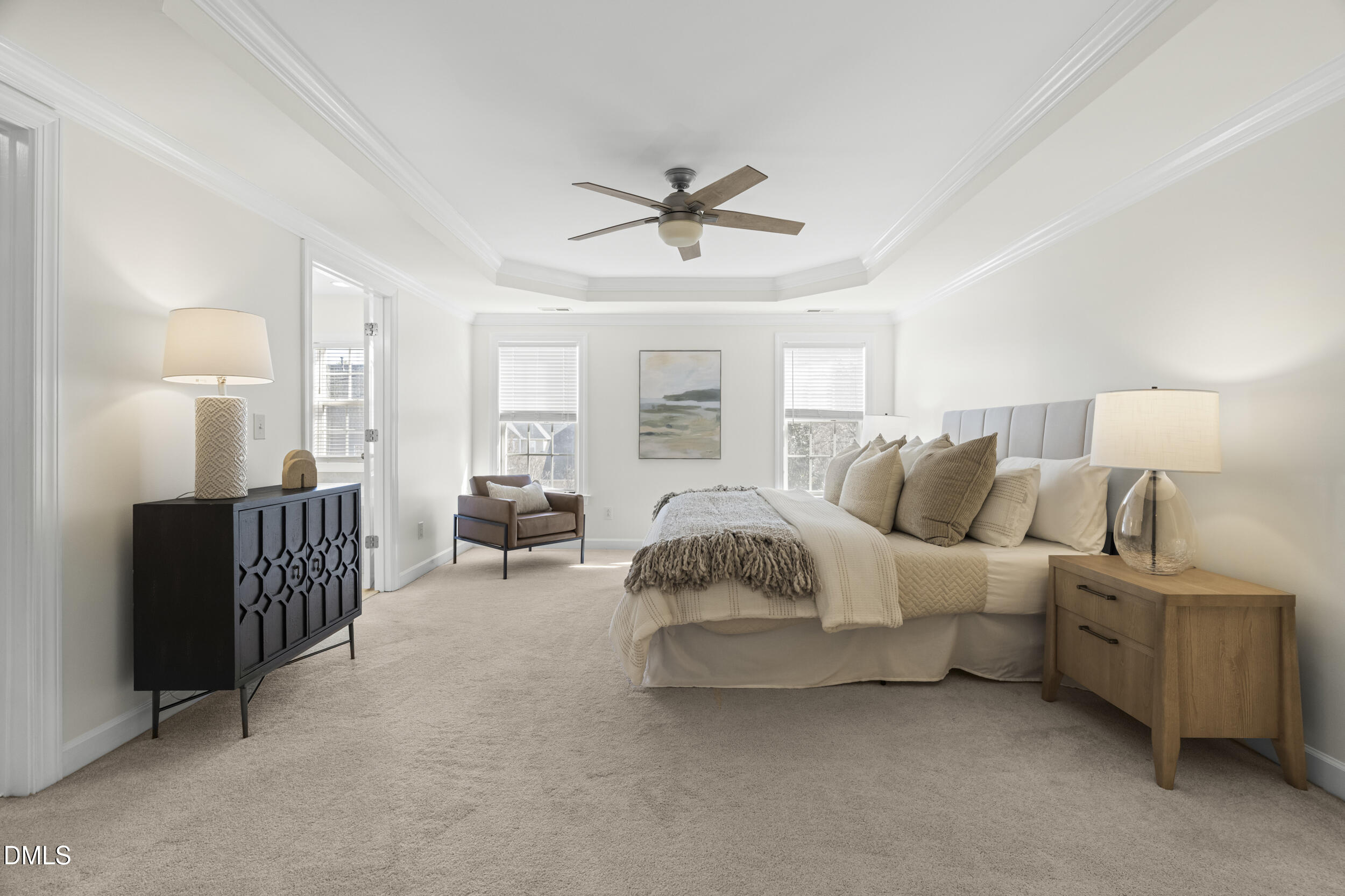 105 Bayless Ridge Court Morrisville, NC 27560 - Photo 25 of 42 a living room with furniture ceiling fan and a window