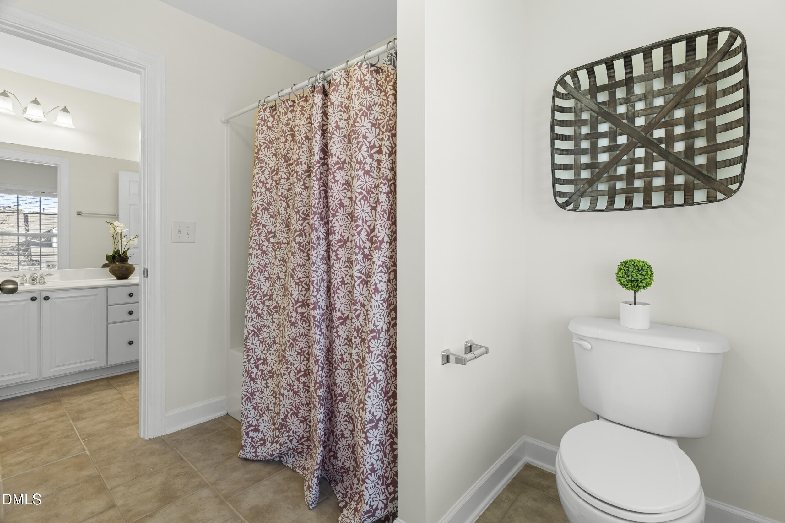 105 Bayless Ridge Court Morrisville, NC 27560 - Photo 35 of 43 a white toilet sitting next to a bathroom sink