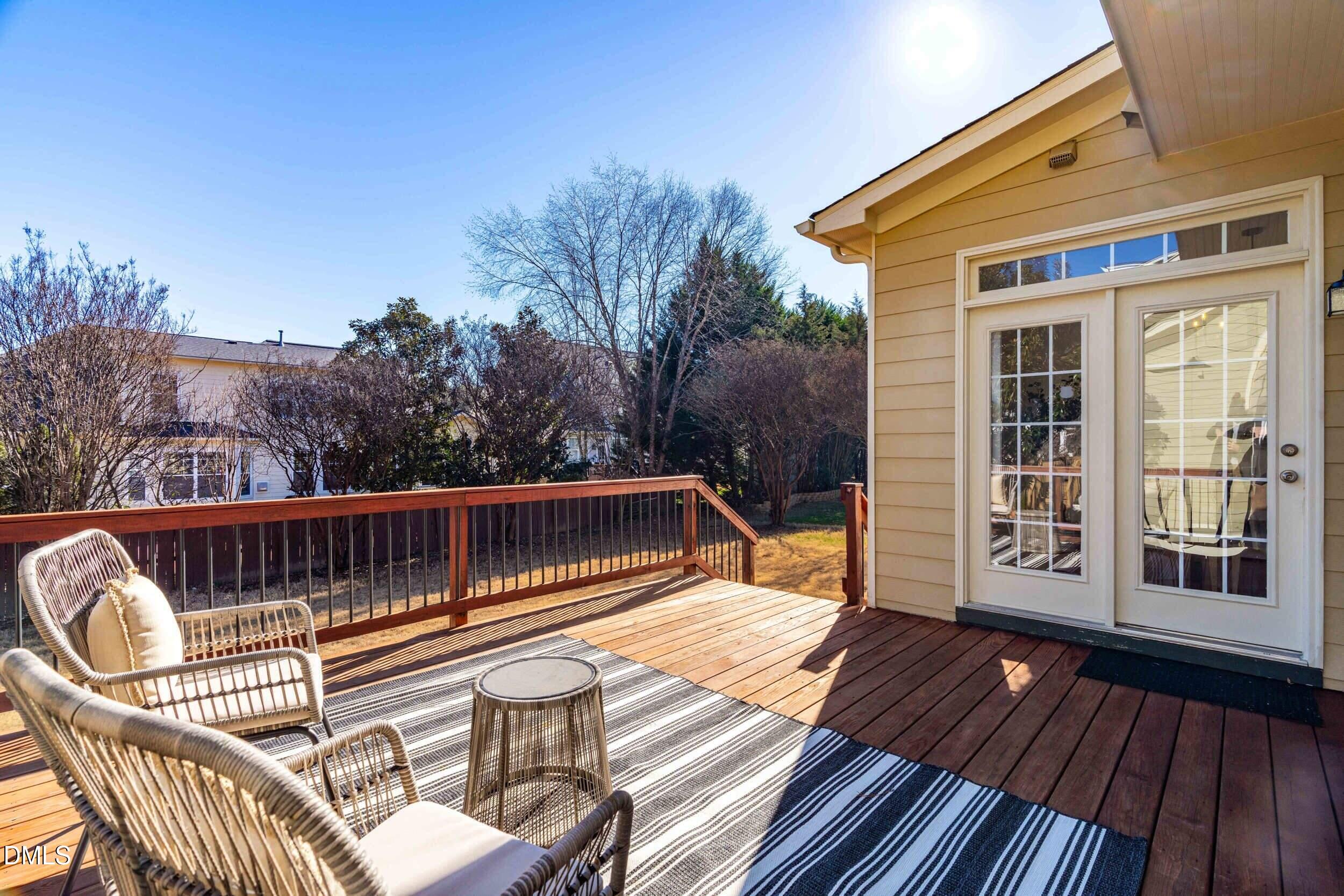 105 Bayless Ridge Court Morrisville, NC 27560 - Photo 39 of 42 a view of a roof deck with wooden floor and fence