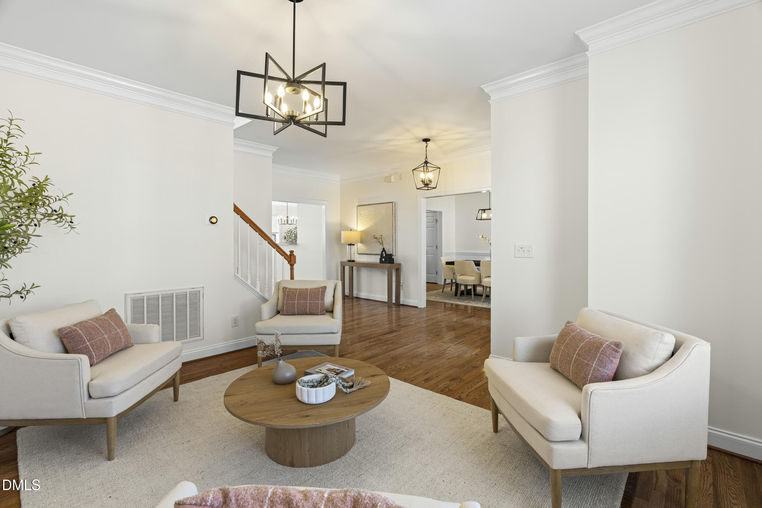 105 Bayless Ridge Court Morrisville, NC 27560 - Photo 8 of 43 a living room with furniture and a chandelier