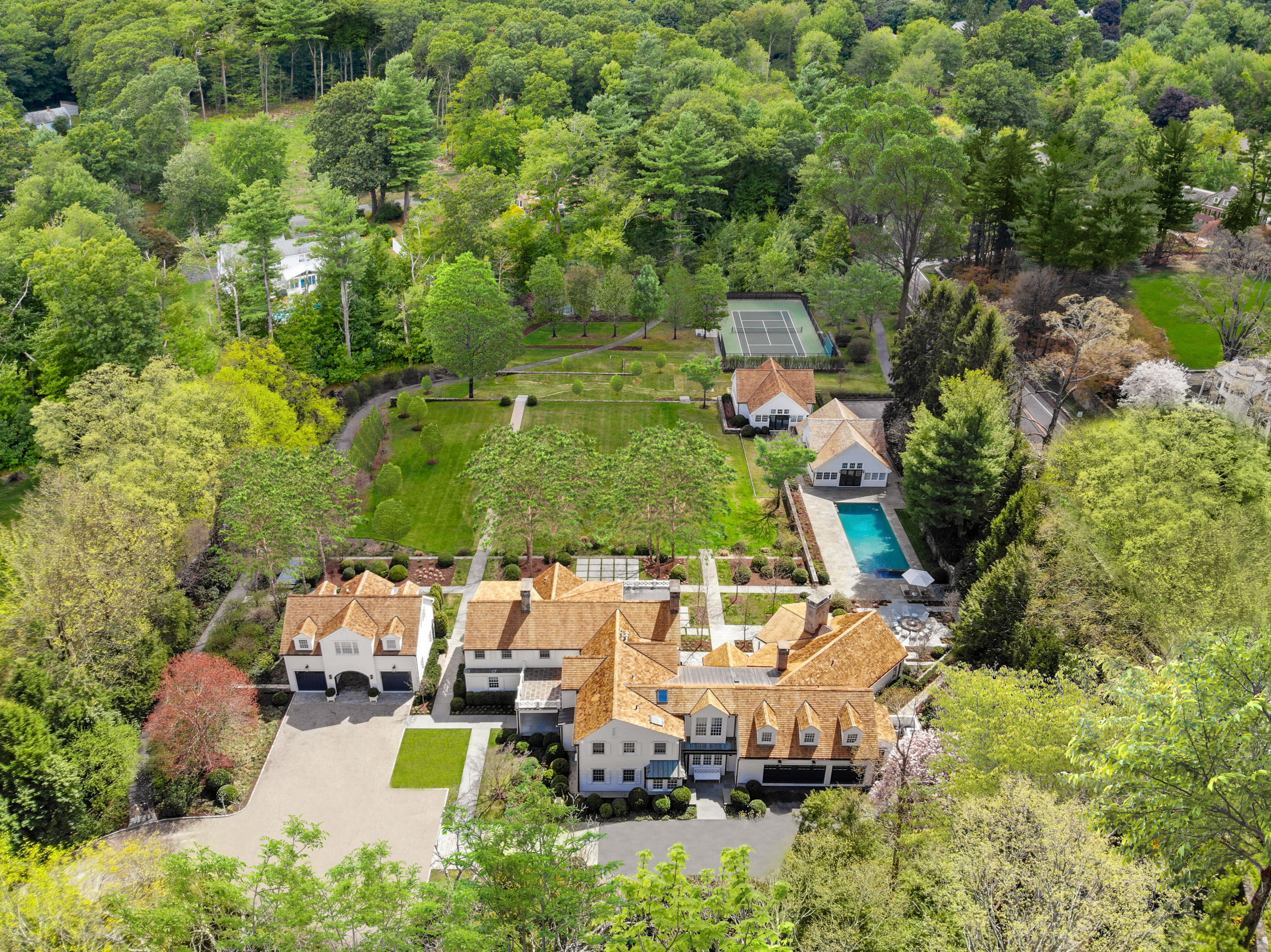 an aerial view of a house with yard swimming pool and outdoor seating