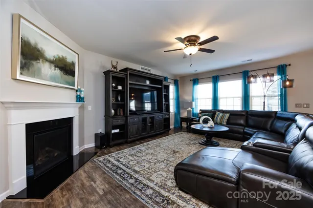 a kitchen with stainless steel appliances granite countertop a refrigerator a stove and a sink with dishwasher