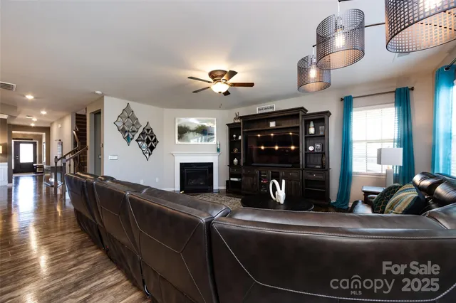 a bedroom with a bed couch and window