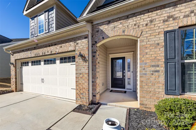 a front view of a house with a garage