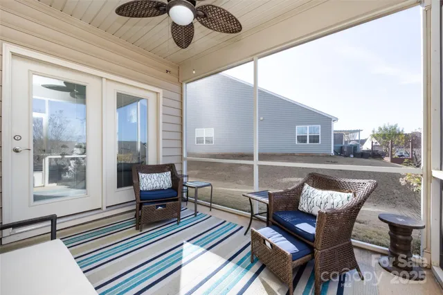 a view of sitting area with furniture and umbrella