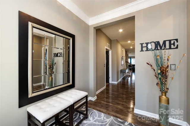 a view of a hallway with wooden floor windows and livingroom