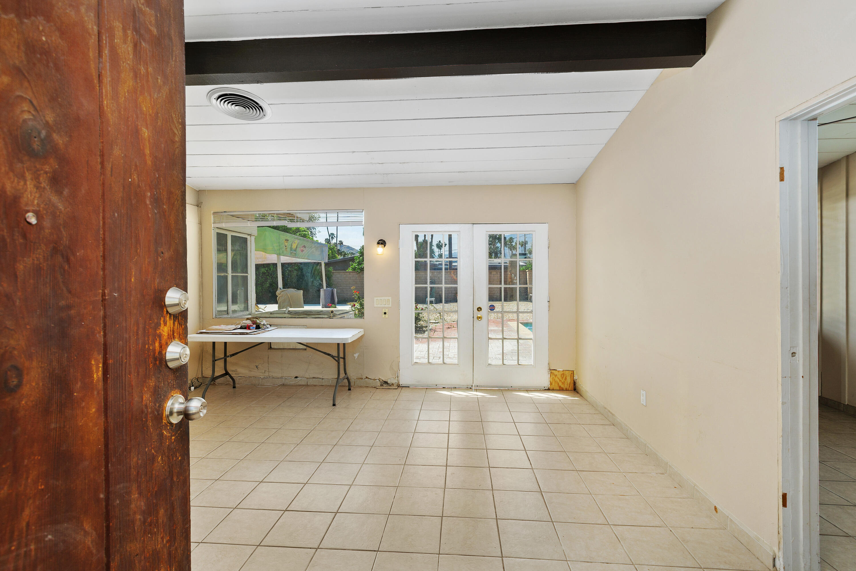 1077 South Riverside Drive Palm Springs, CA 92264 - Photo 8 of 35 a living room with a large window