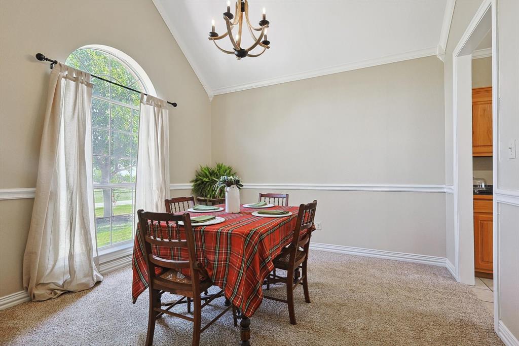 3289 Mitchell Road Krum, TX 76249 - Photo 13 of 38 a view of a dining room with furniture window and outside view