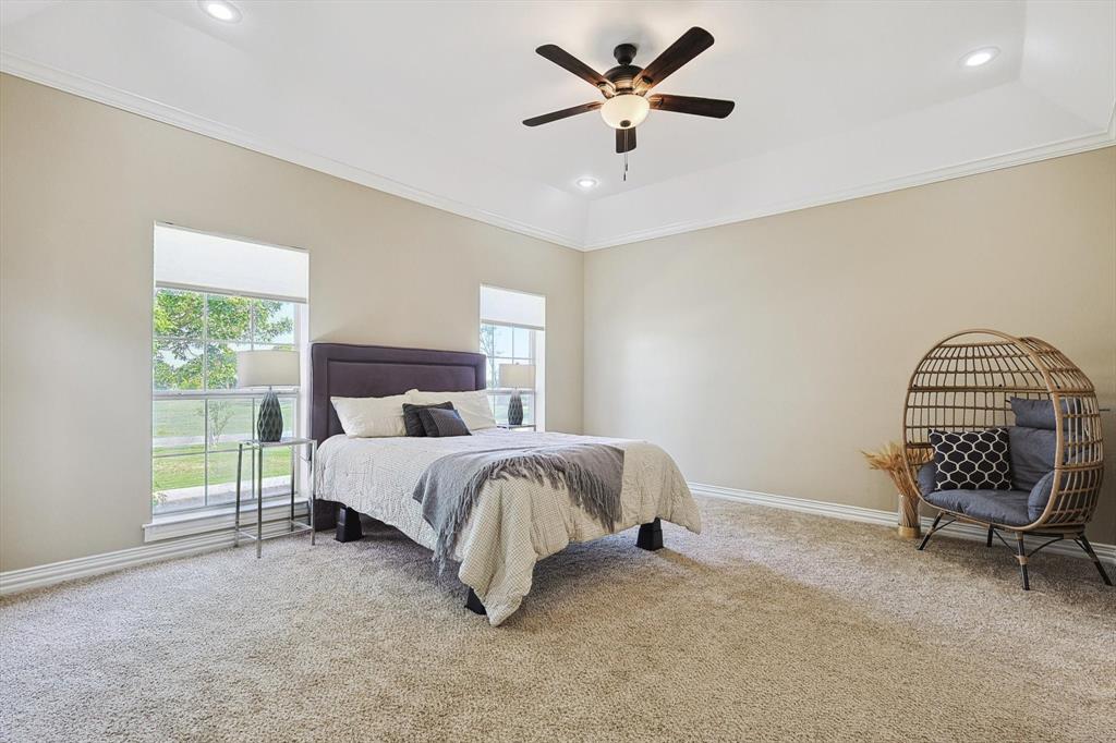3289 Mitchell Road Krum, TX 76249 - Photo 14 of 38 a bed room with a bed and a chair