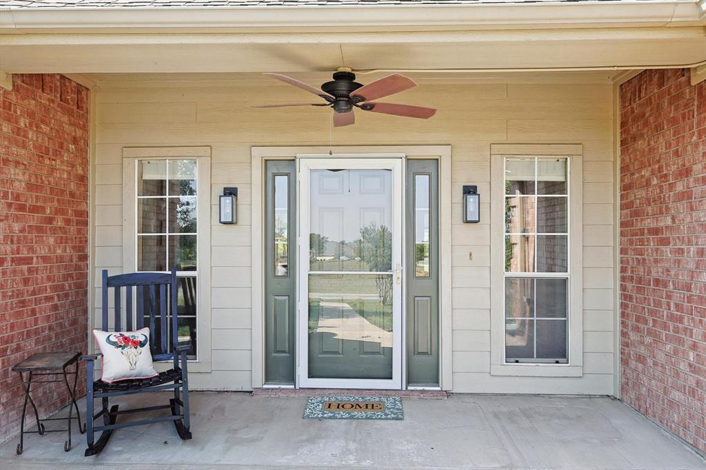 3289 Mitchell Road Krum, TX 76249 - Photo 3 of 38 a view of a entryway door front of house